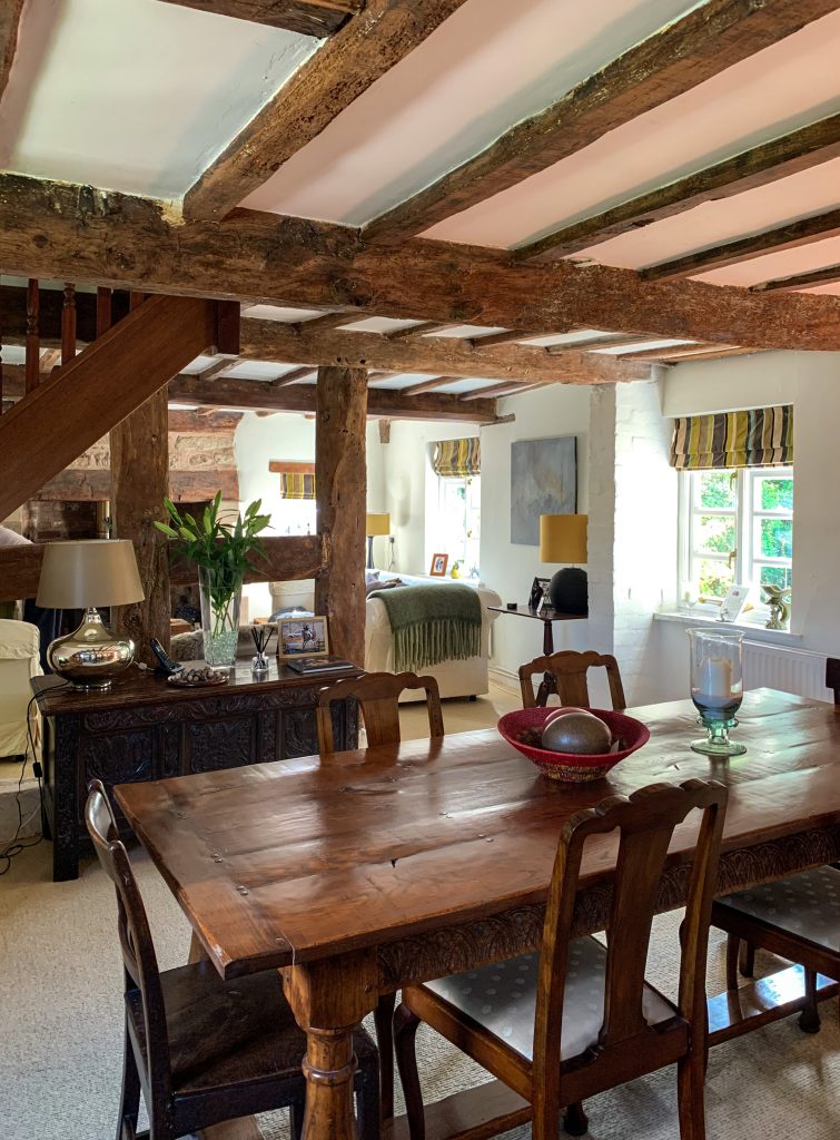 a dining room table in front of a window