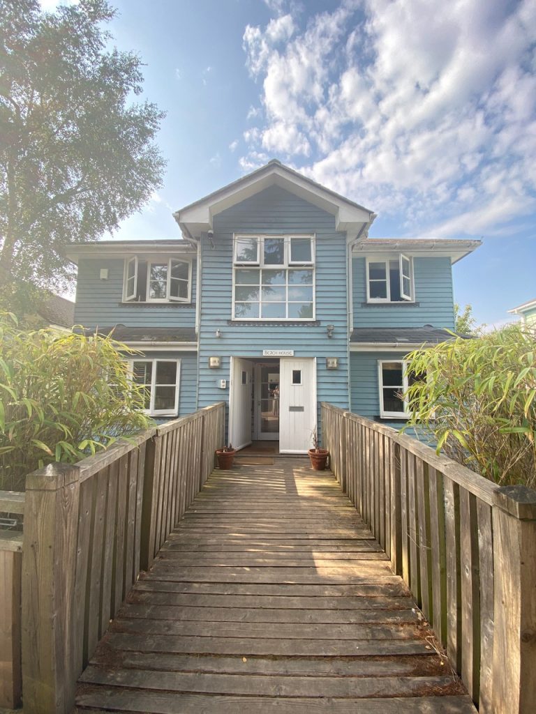 a house with a wooden fence