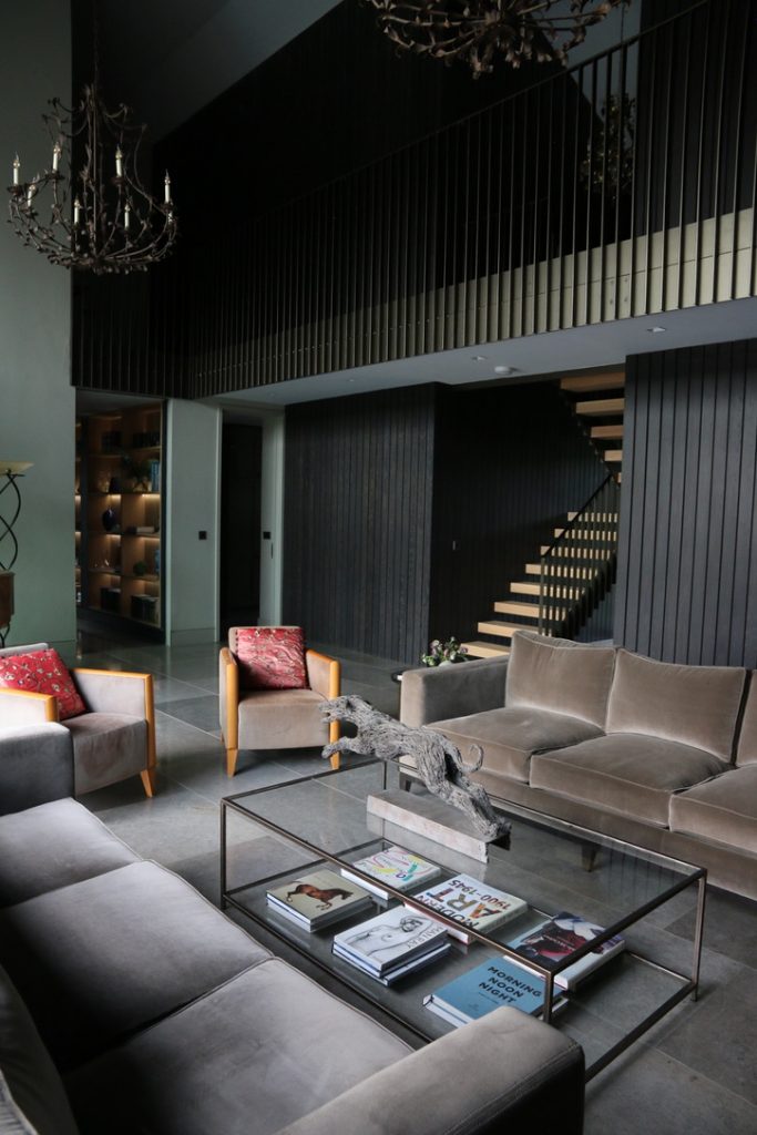 a living room filled with furniture and a fireplace