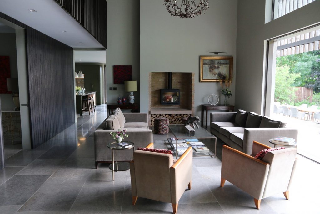 a living room filled with furniture and a large window