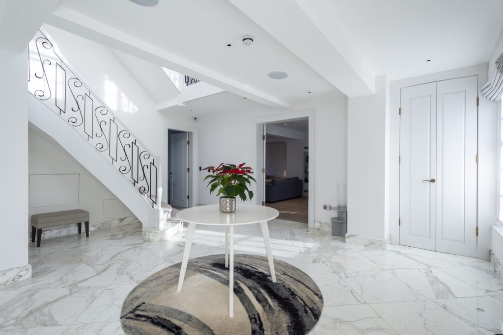 a living area with a building in the background