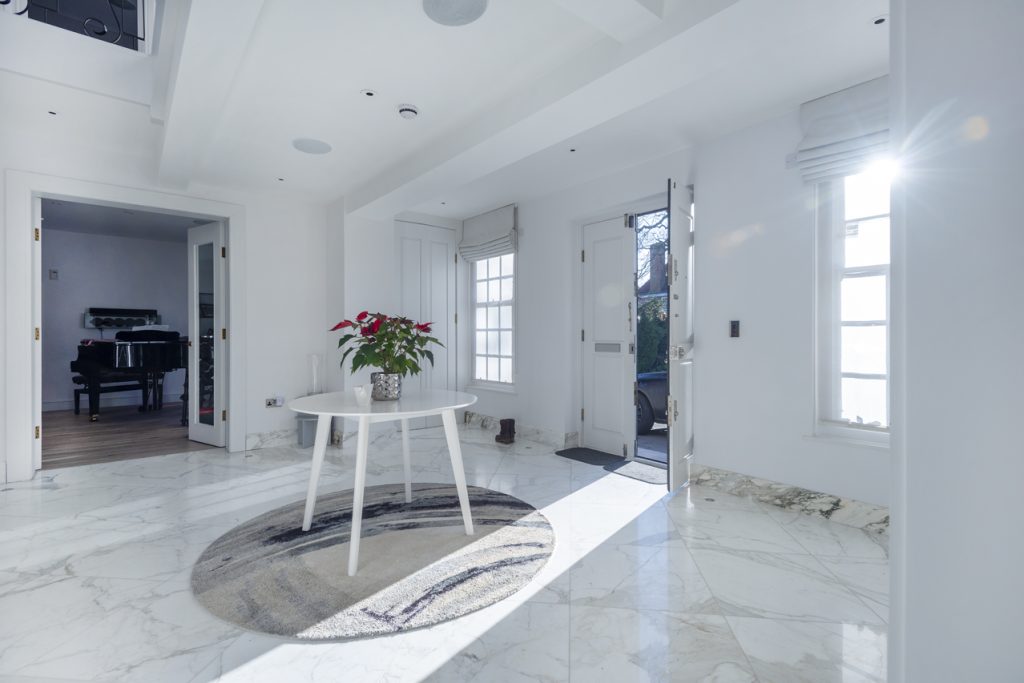 a room filled with furniture and a large window