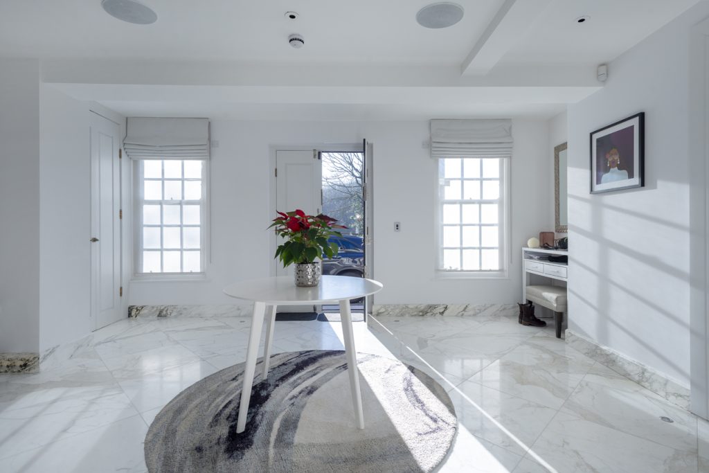 a room filled with furniture and a large window