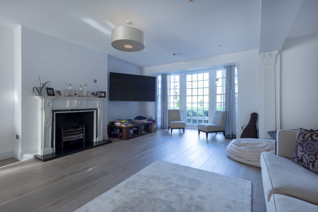 a living room filled with furniture and a fireplace