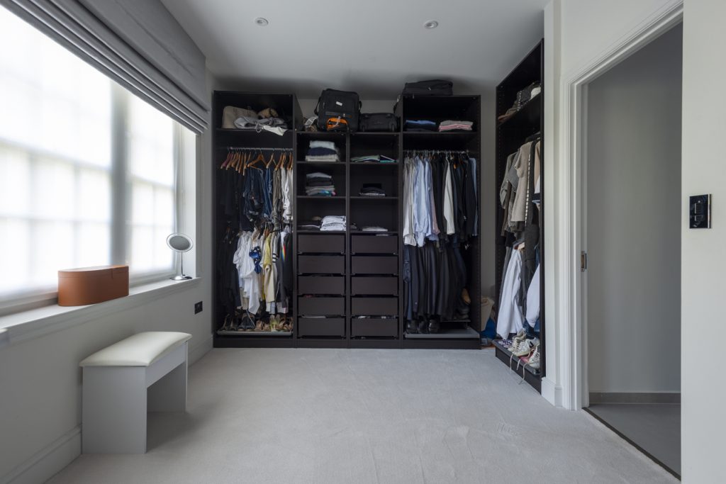 a room filled with furniture and a large window