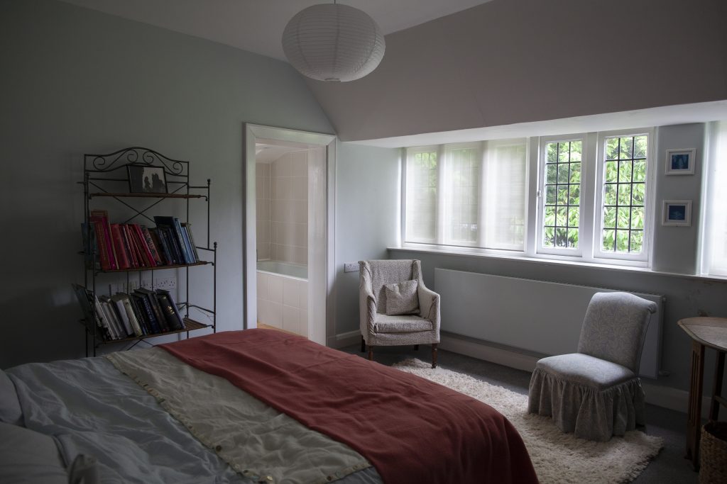 a bedroom with a large bed in a hotel room