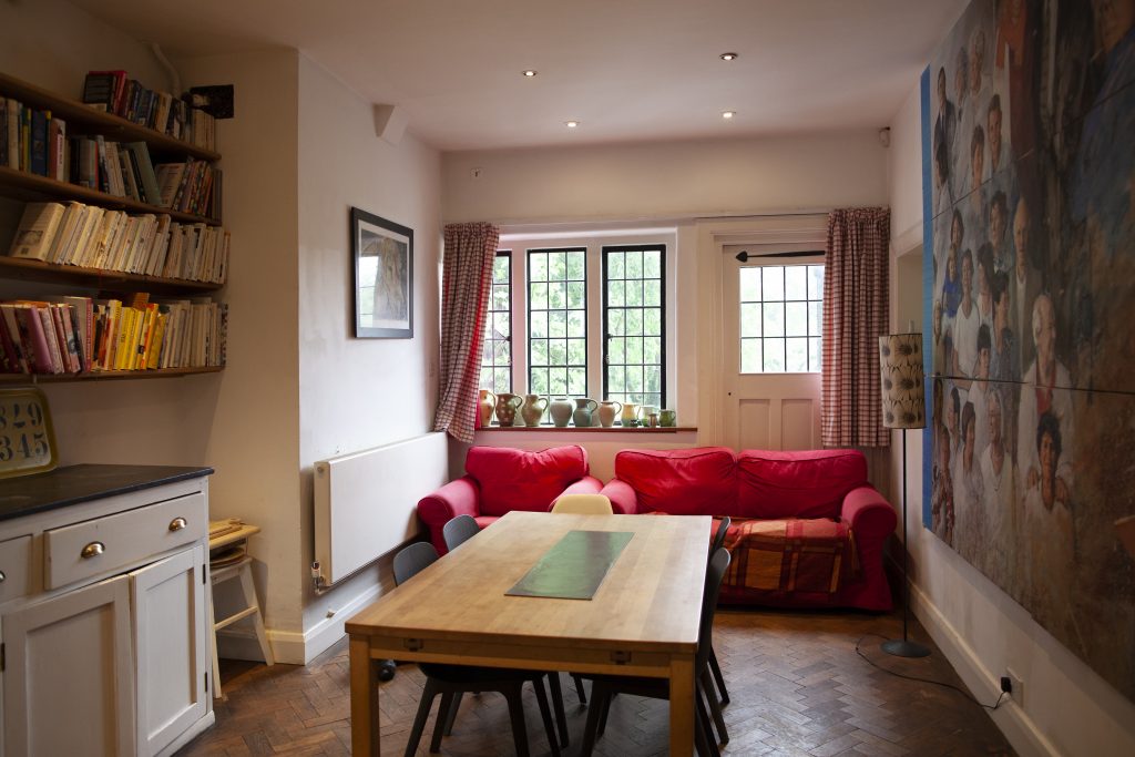 a living room filled with furniture and a large window