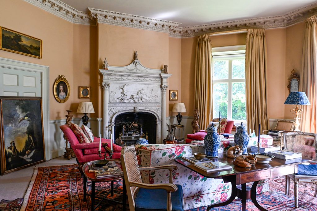 a living room filled with furniture and a fire place