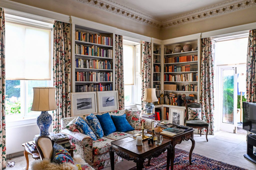 a living room filled with furniture and a large window