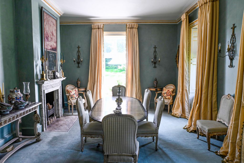 a living room filled with furniture and a fire place