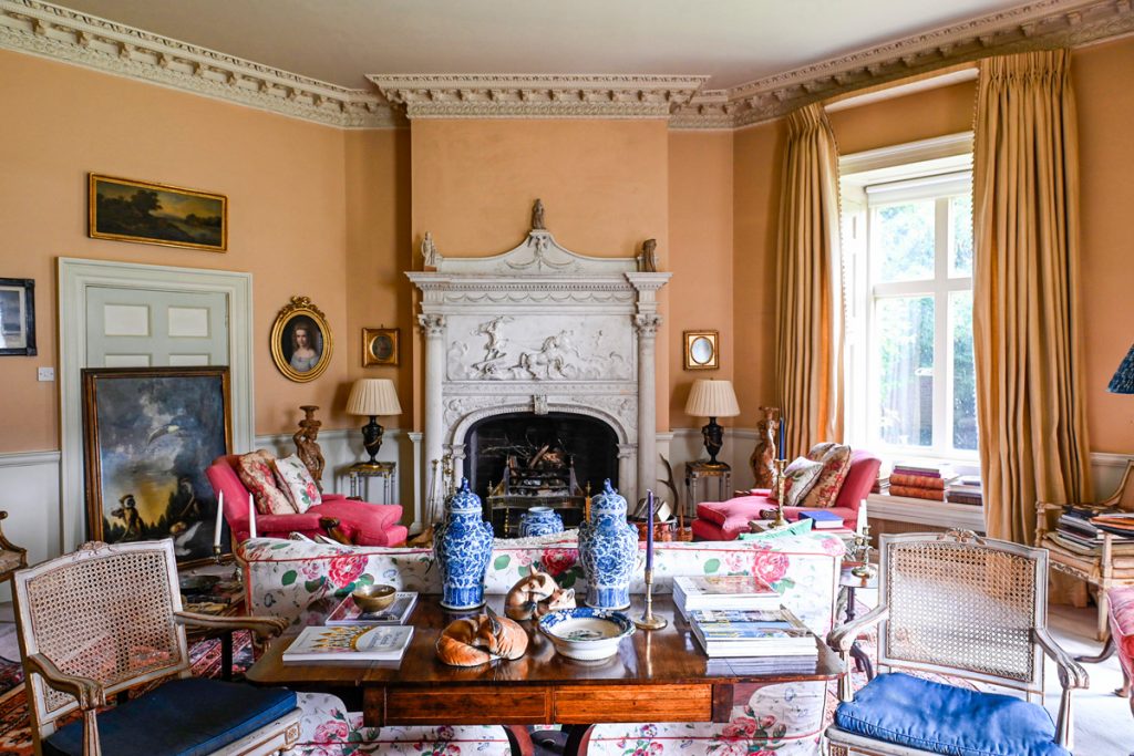 a living room filled with furniture and a fire place