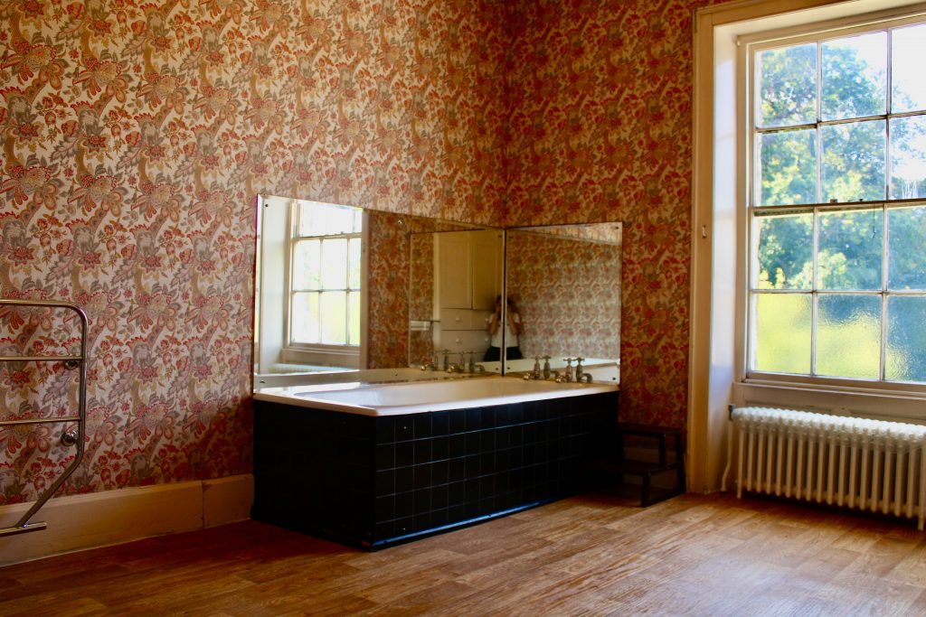 a bedroom with a large window