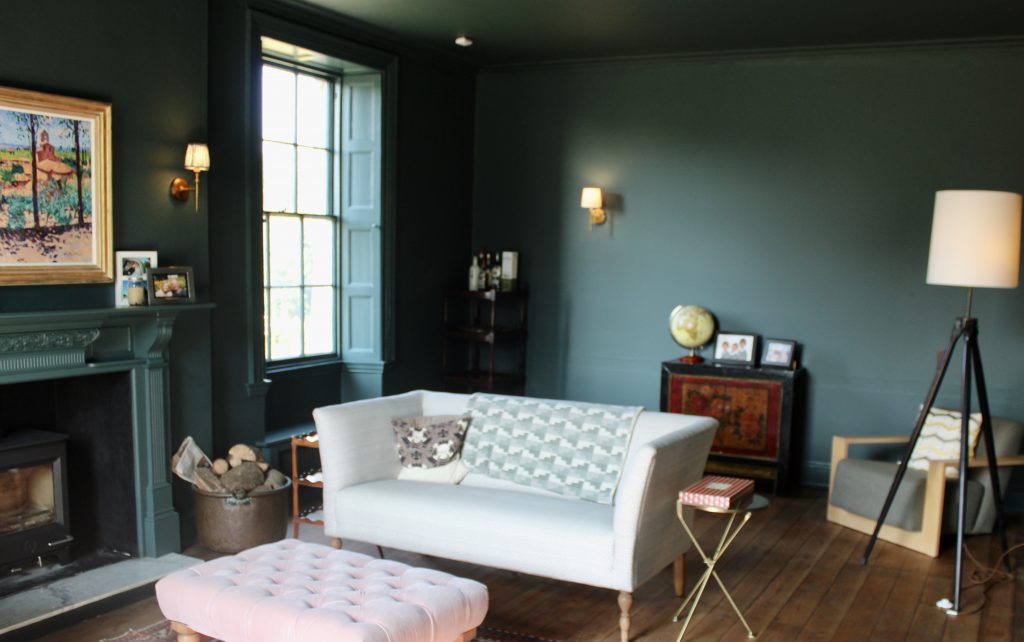 a living room filled with furniture and a fire place