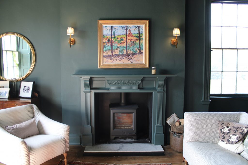 a living room filled with furniture and a fire place