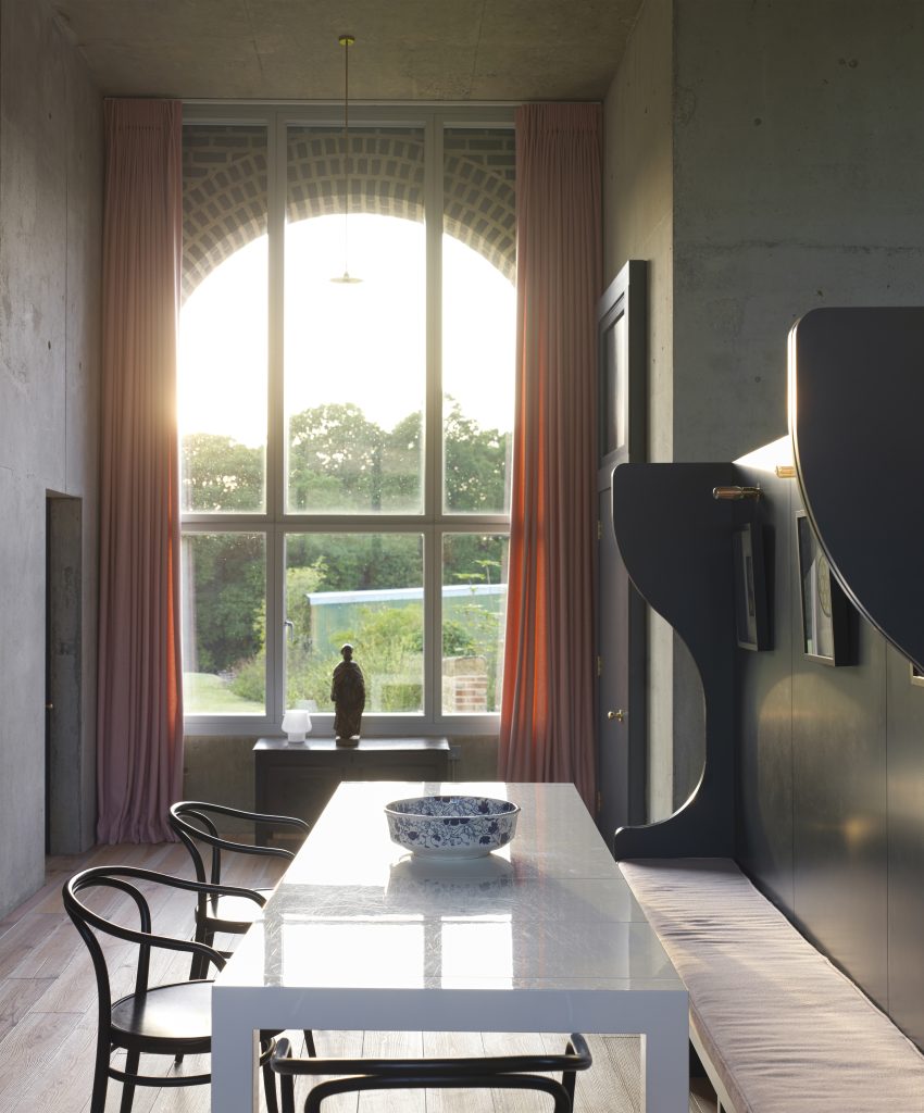 a dining room table in front of a window