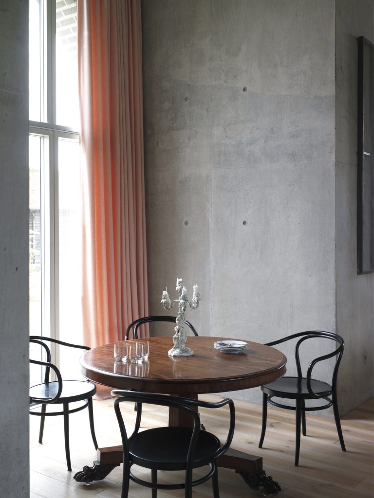 a dining room table in front of a window