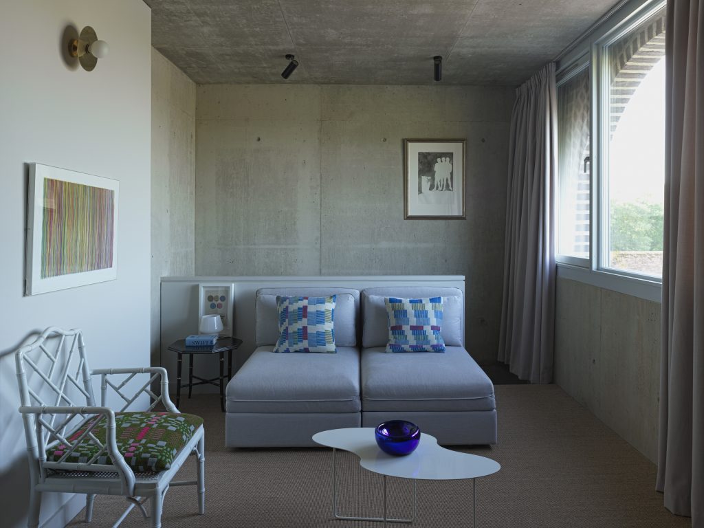 a bedroom with a bed in a room