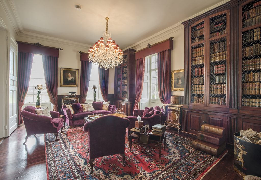 a living room filled with furniture and a fireplace