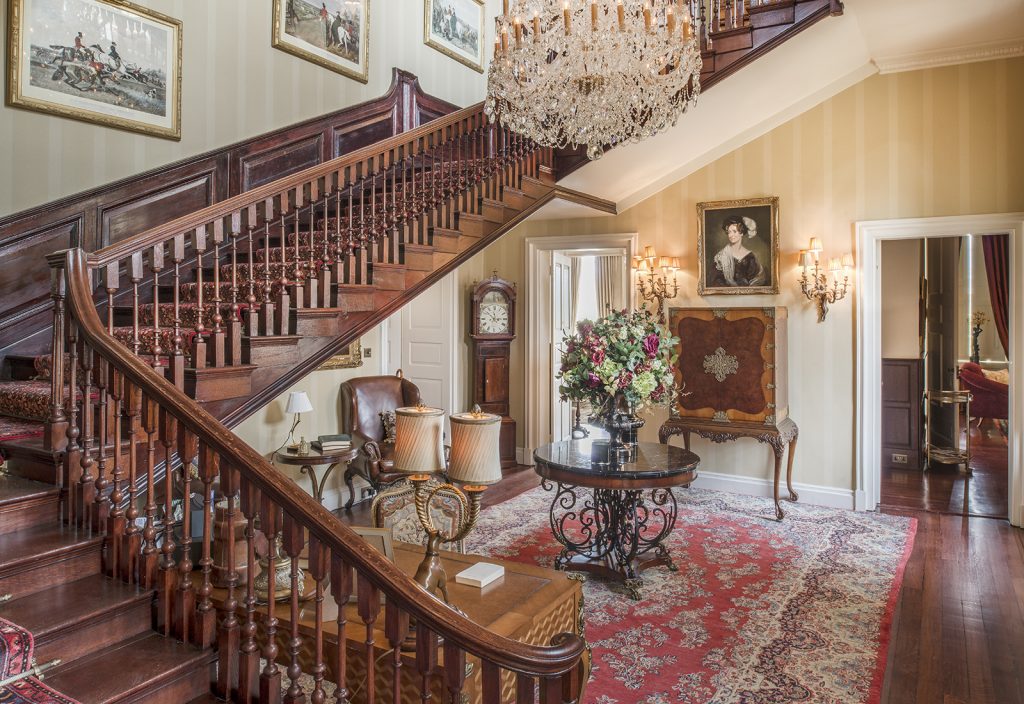 a room filled with furniture and a fireplace