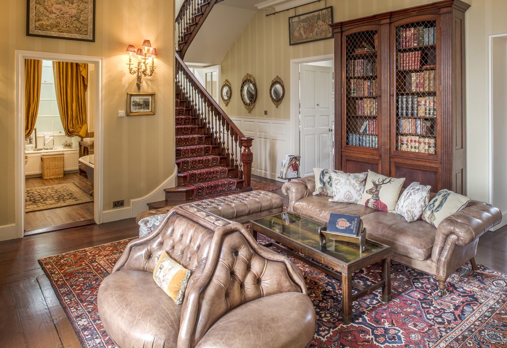 a living room filled with furniture and a fireplace
