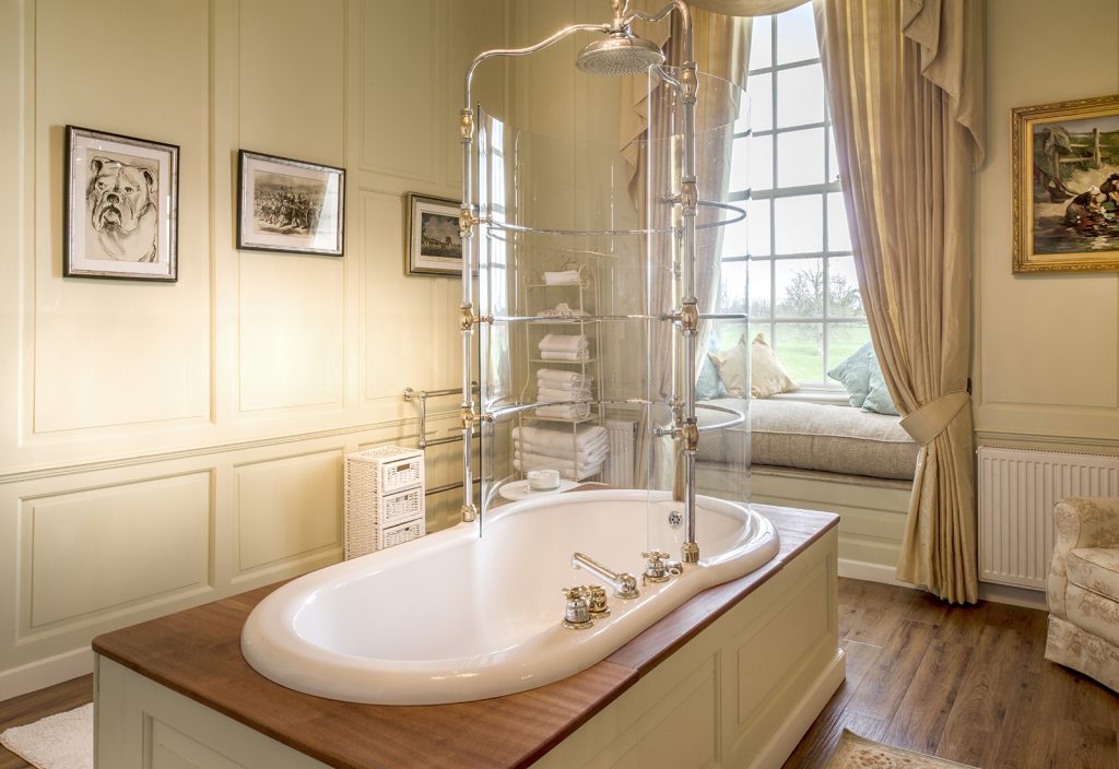 a room with a sink and a mirror