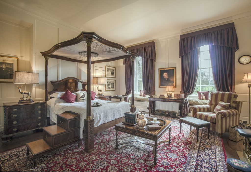 a living room filled with furniture and a fireplace