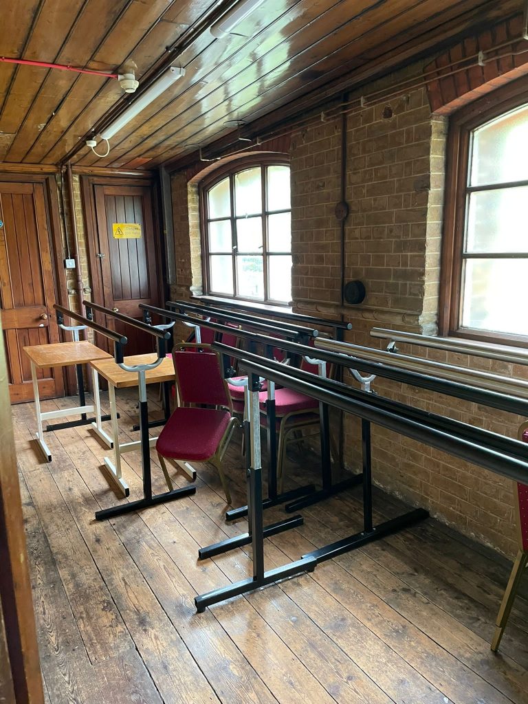 a room filled with furniture and a large window