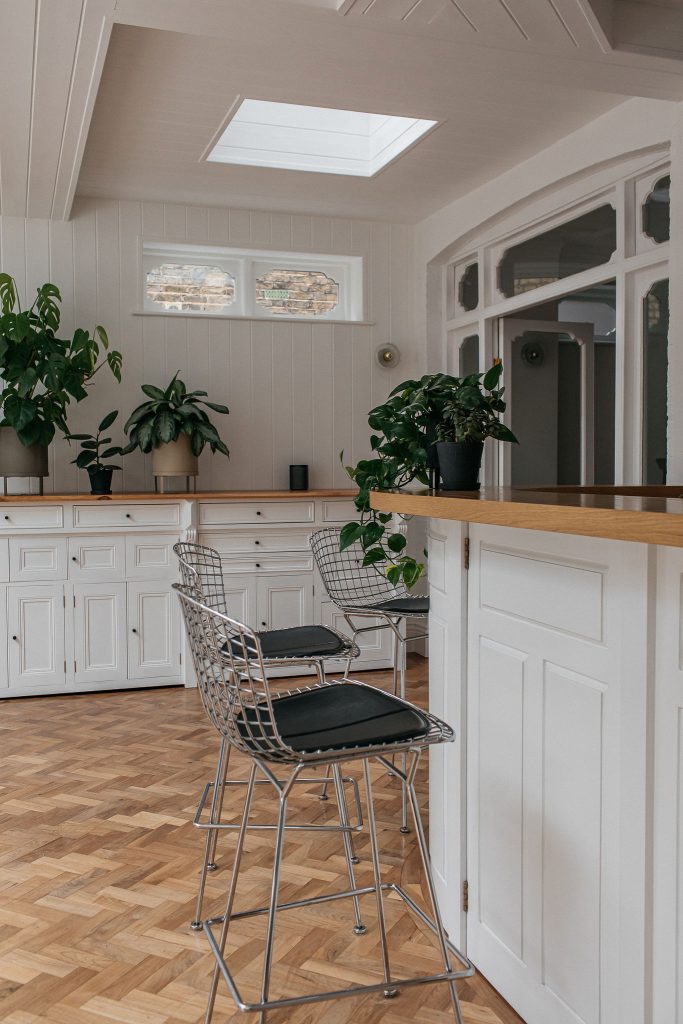 a room filled with furniture and a large window