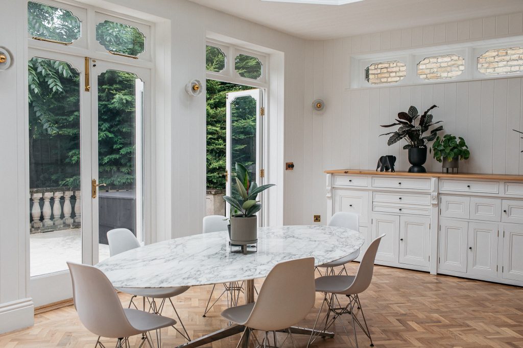 a dining room table in front of a window