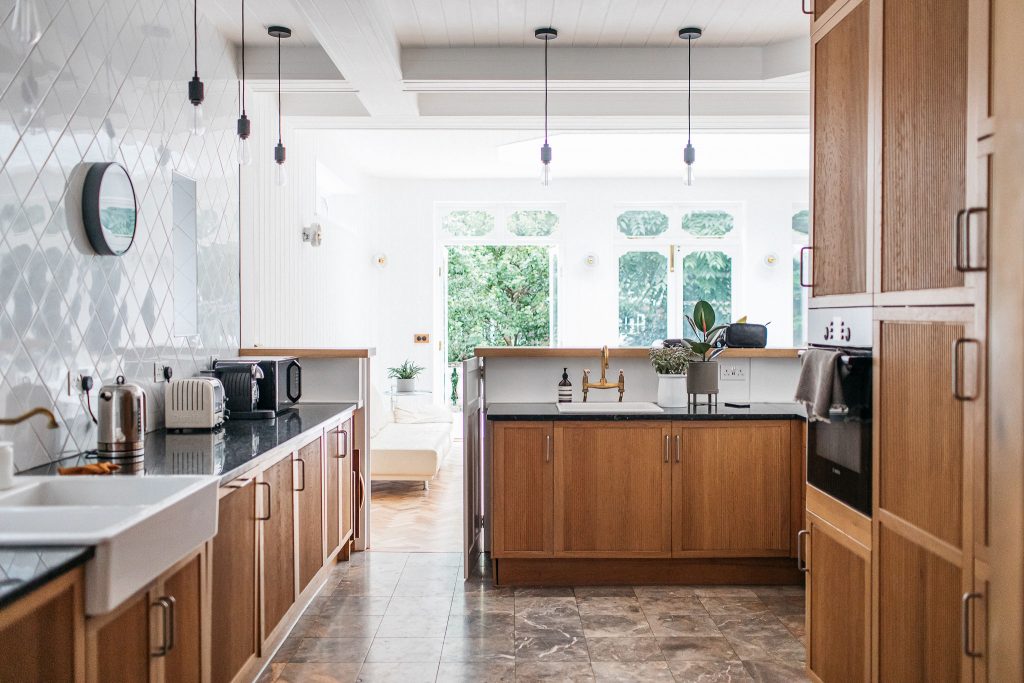 a kitchen with wooden cabinets and a sink