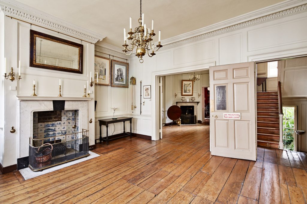 a living room filled with furniture and a fireplace