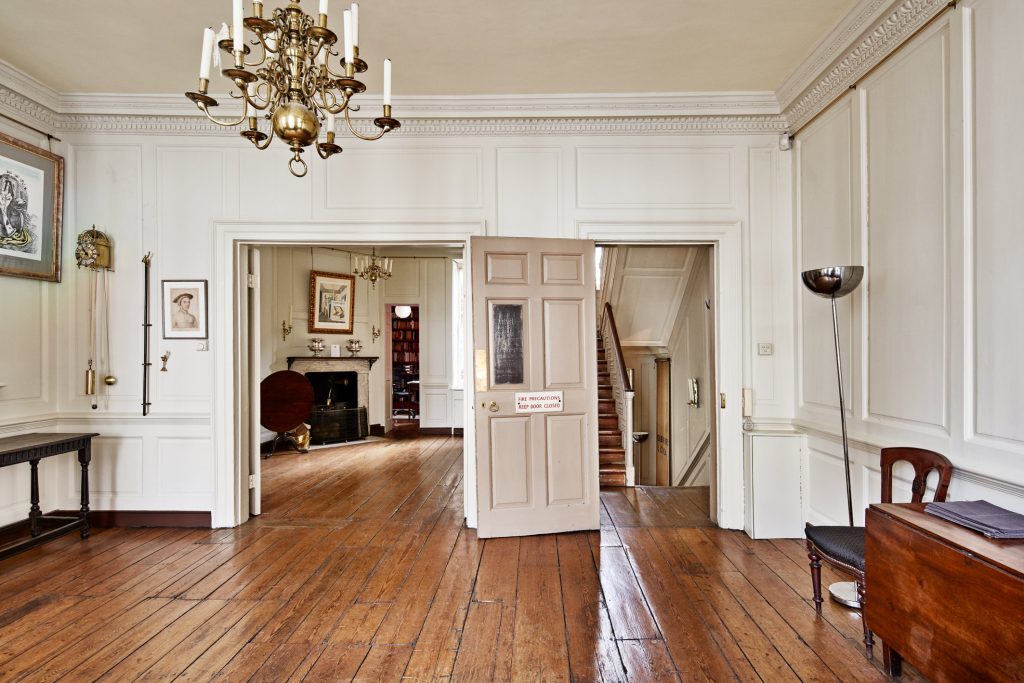 a room filled with furniture and a fireplace