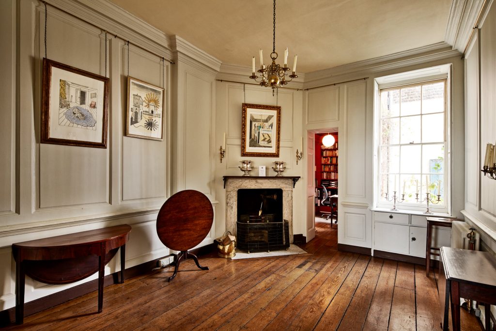 a room filled with furniture and a fireplace