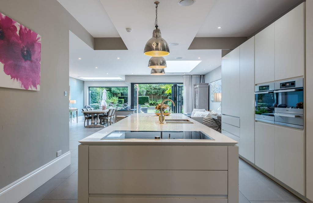 a kitchen with an island in the middle of a room