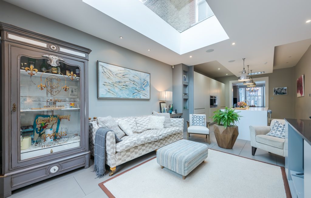 a room filled with furniture and a fireplace