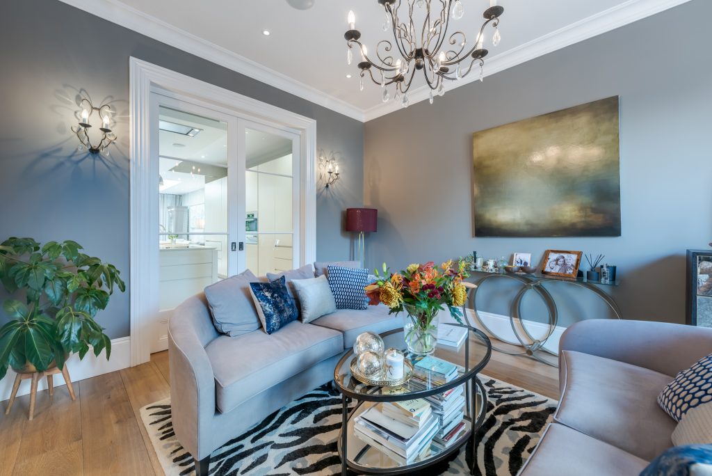 a living room filled with furniture and a fire place
