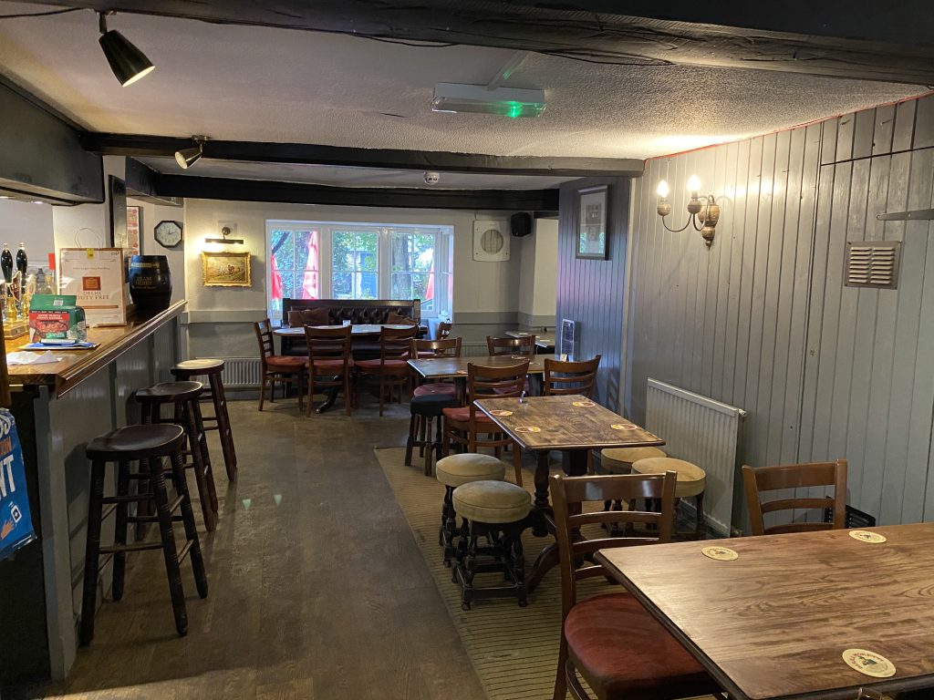 a room filled with furniture and a table in a restaurant