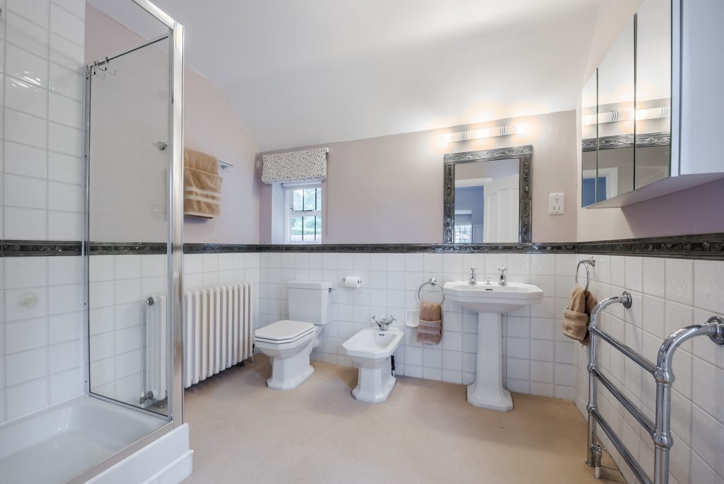 a room with a sink and a mirror