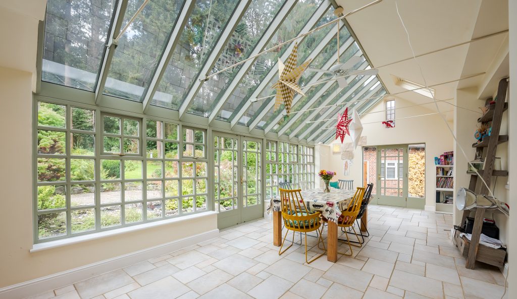 a room filled with furniture and a large window