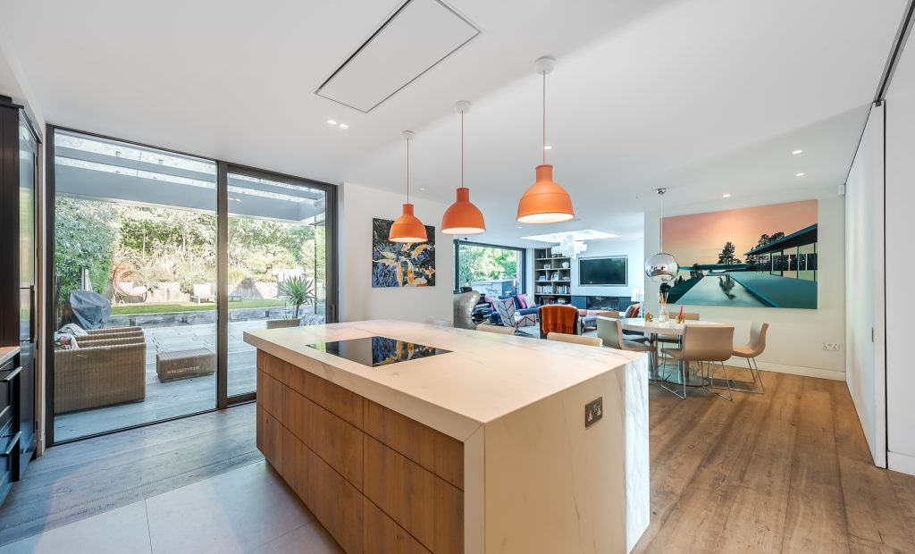 a kitchen with an island in the middle of a room