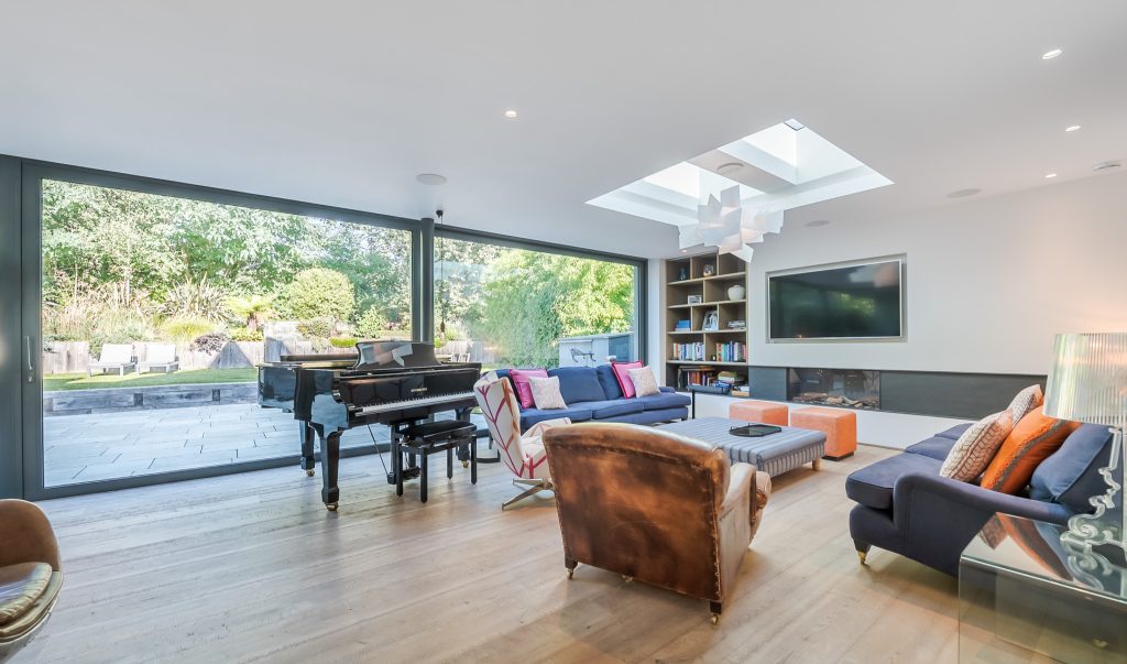 a living room filled with furniture and a large window