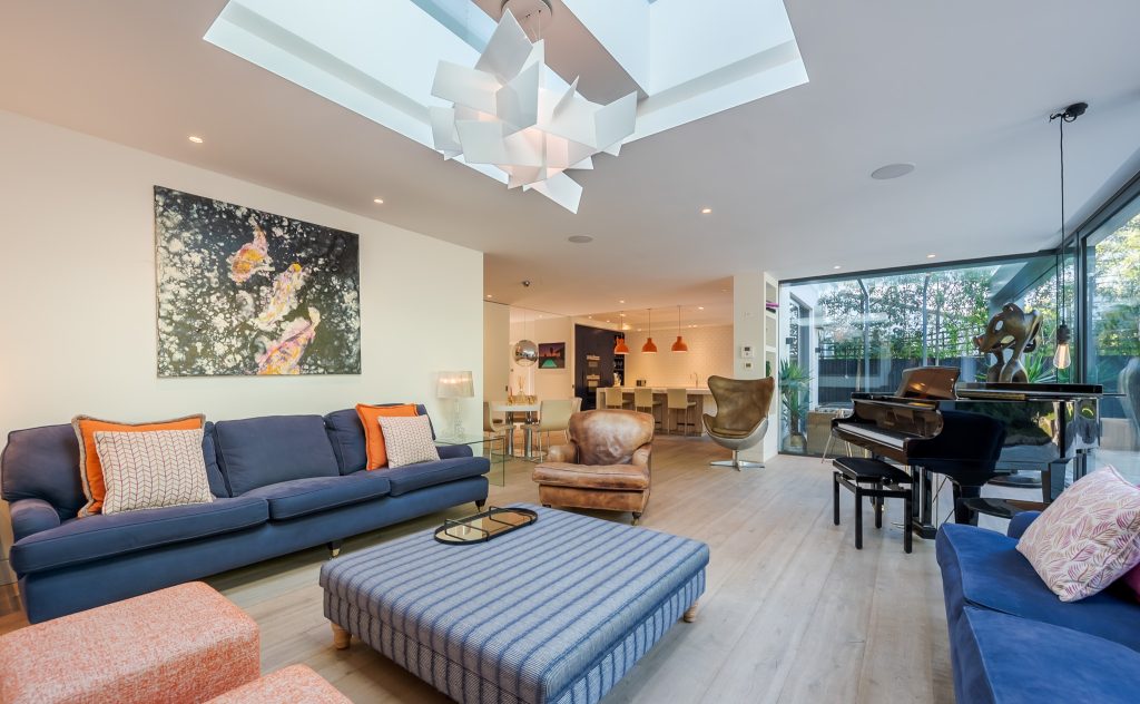 a living room filled with furniture and a flat screen tv