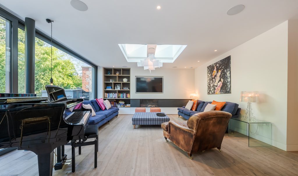 a living room filled with furniture and a large window