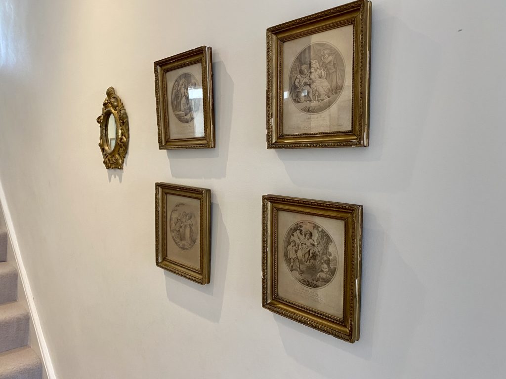 a painting hanging on a wall