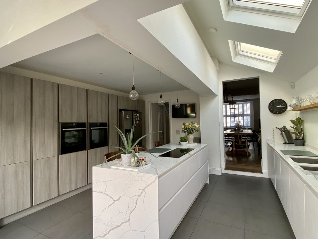 a kitchen area with a building in the background