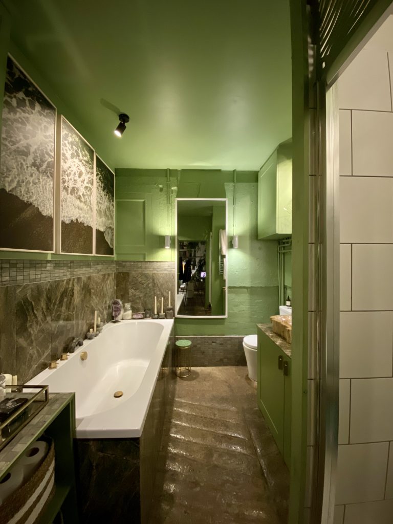 a room with a sink and a mirror