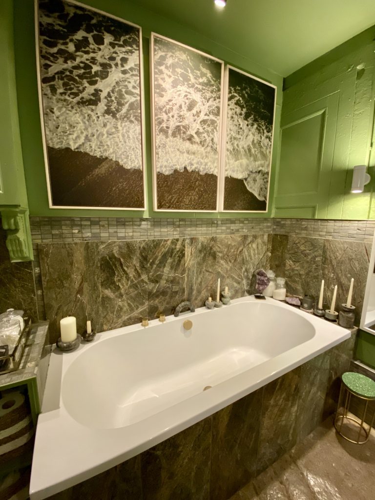 a close up of pink tub and sink
