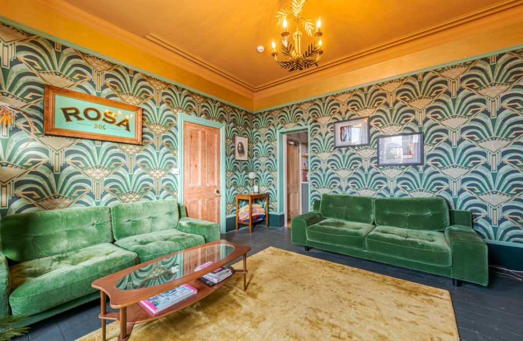 a green sofa in a living room