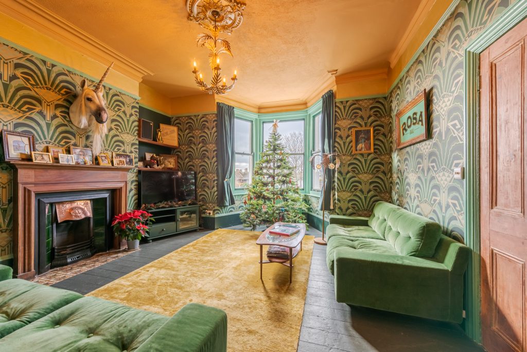 a living room filled with furniture and a fire place