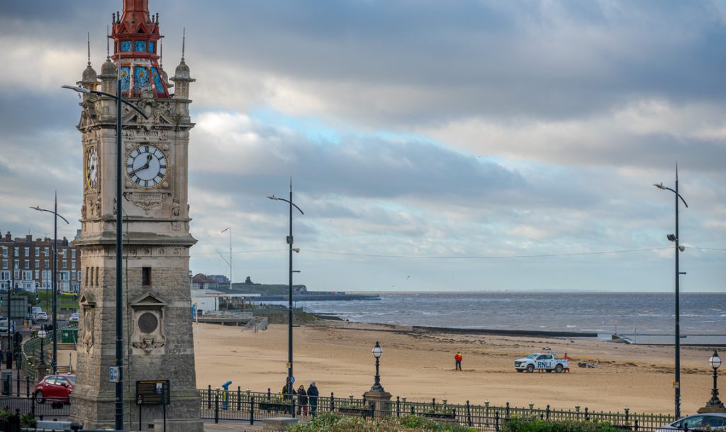 a clock tower on a cloudy day